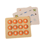 Child playing with wooden memory matching game tiles