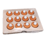 Child playing with wooden memory matching game tiles