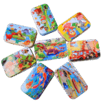 Wooden jigsaw puzzle pieces inside a tin box