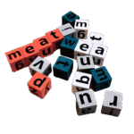 Wooden alphabet spelling game with bell on table